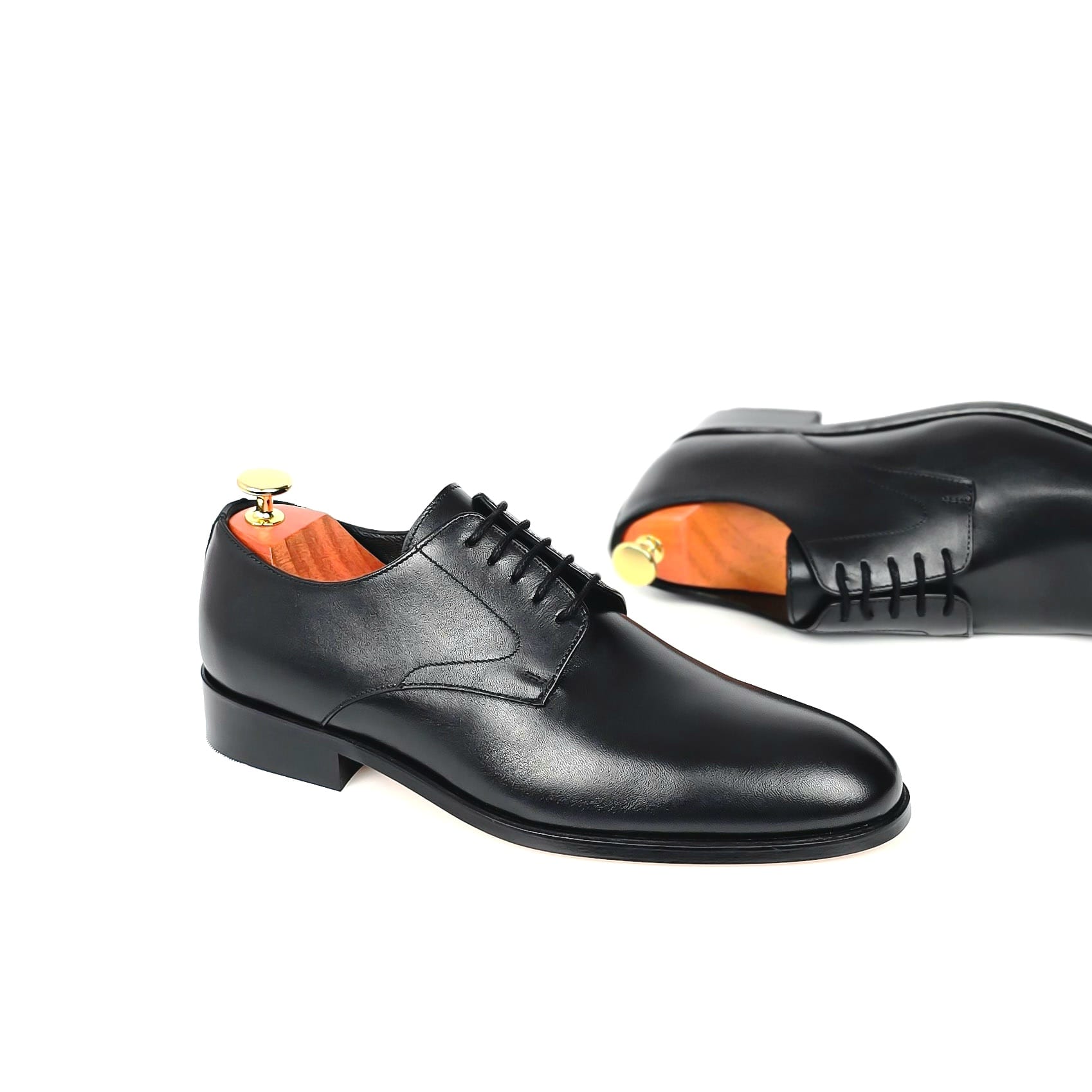 Classic black men's plain toe derby dress shoe side view